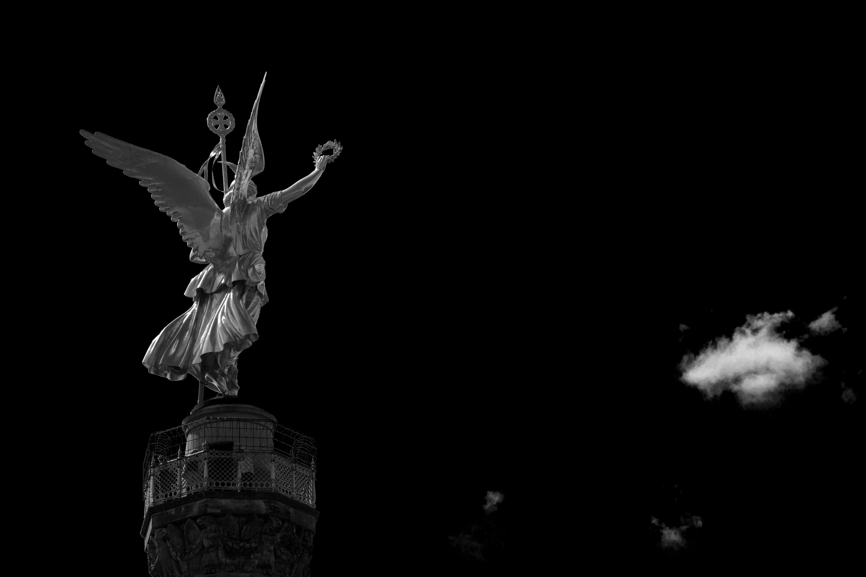 berlins victory column in dark sky
