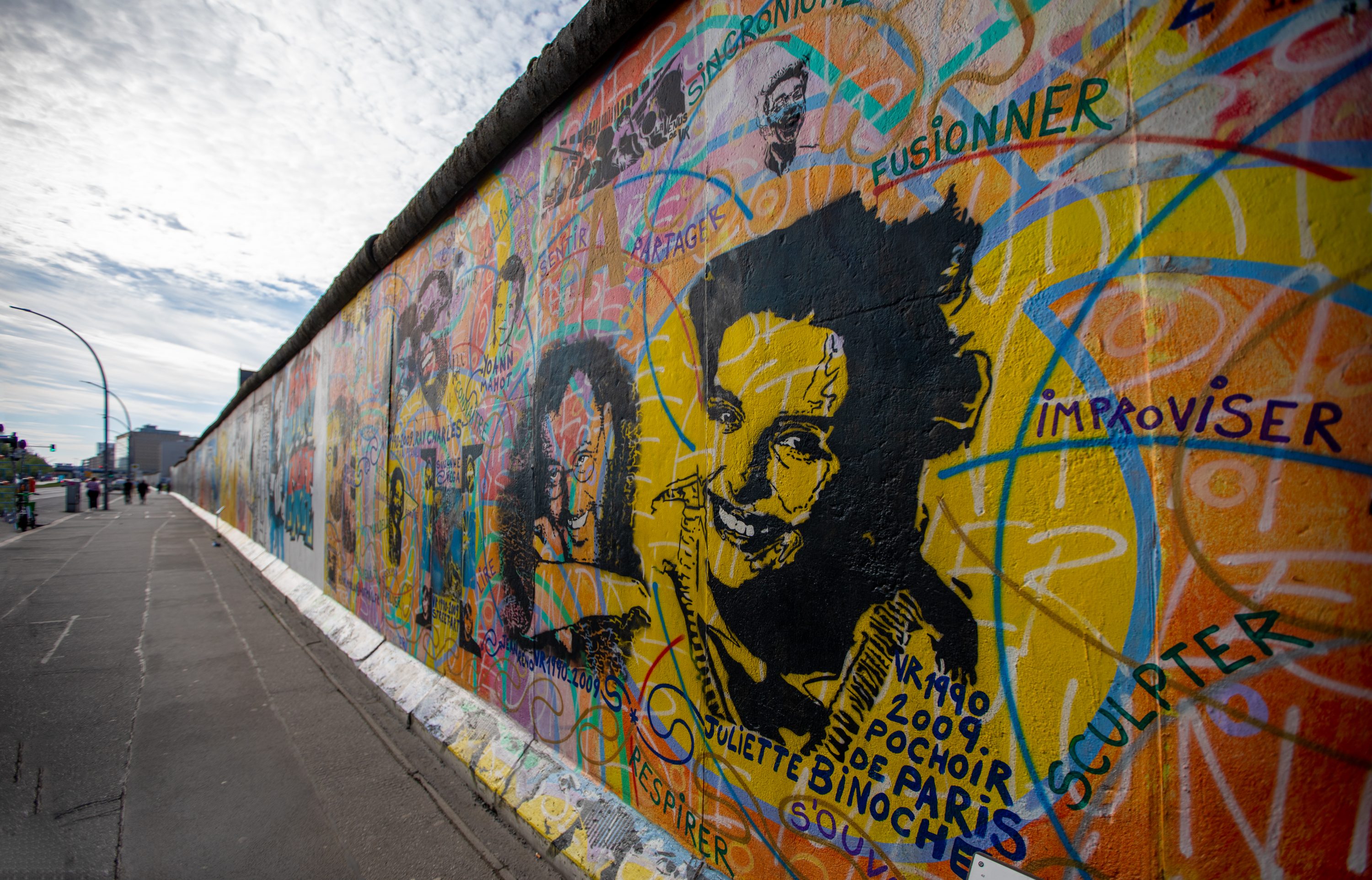 Colourful murals at the East Side Gallery tell stories of freedom, hope, and artistic expression.